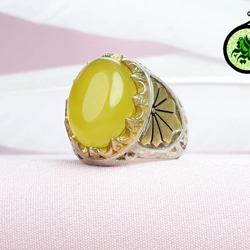 انگشترنقره عقیق زرد شرف الشمس اصل (مزین به دعای شرف الشمس)تاج برنجی بغل برنجی کاری شده