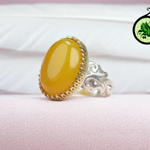 انگشترنقره عقیق زرد شرف الشمس اصل(مزین به دعای شرف الشمس)طرح اشکی تاج برنجی