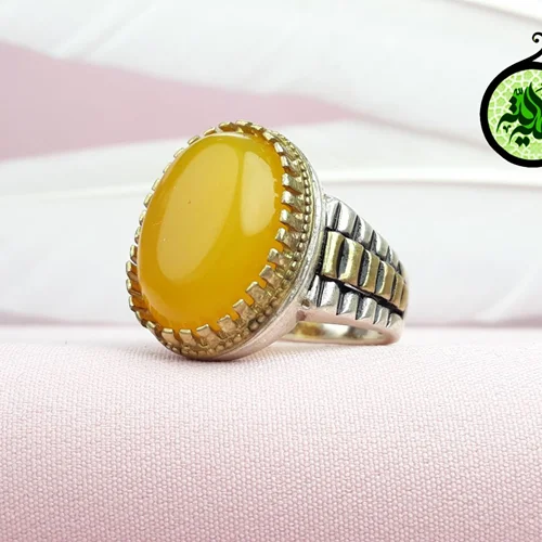 انگشترنقره عقیق زرد شرف الشمس اصل(مزین به دعای شرف الشمس)رکاب طرح رولکسی تاج برنجی