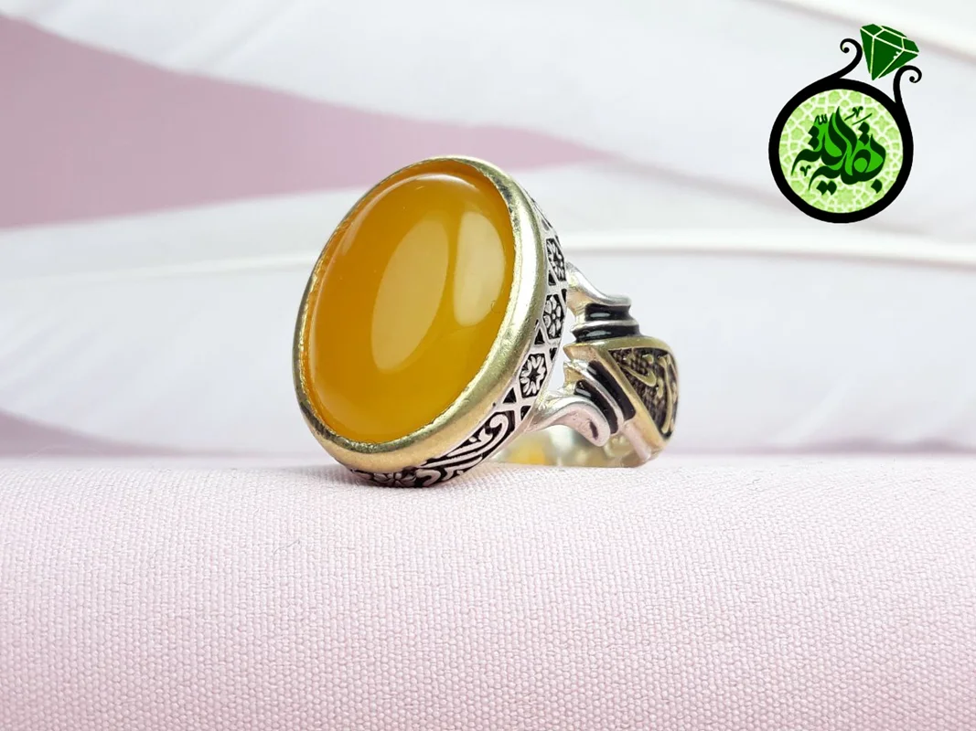 انگشترنقره عقیق زرد شرف الشمس اصل(مزین به دعای شرف الشمس)بغل رکاب یا زینب تاج برنجی