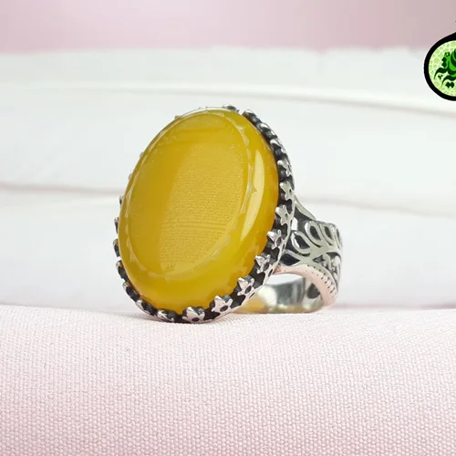 انگشترنقره عقیق زرد شرف الشمس اصل(دعای شرف الشمس)حکاکی حرز کبیر امام جواد(ع)رکاب طرح طاووس